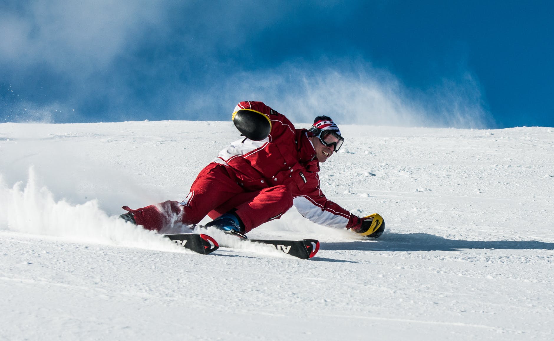 man on ski board on snow field